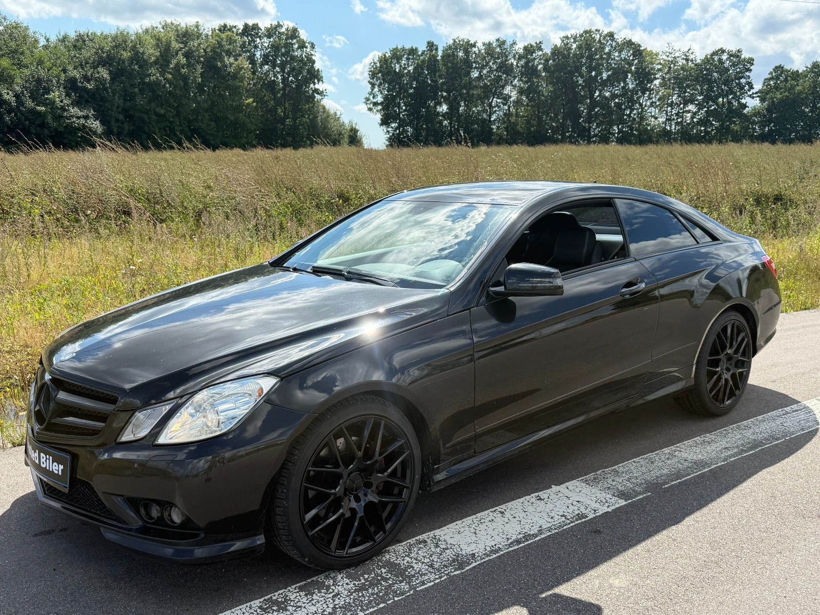 Rød Mercedes E200 fra 2011