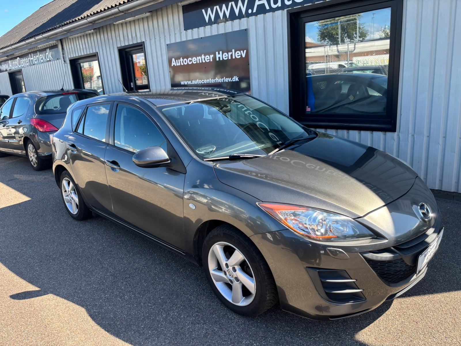 Grå Mazda 3 fra 2011