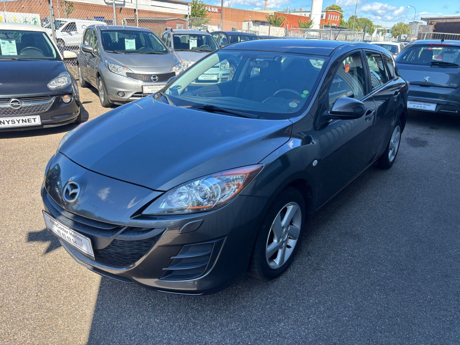 Grå Mazda 3 fra 2011