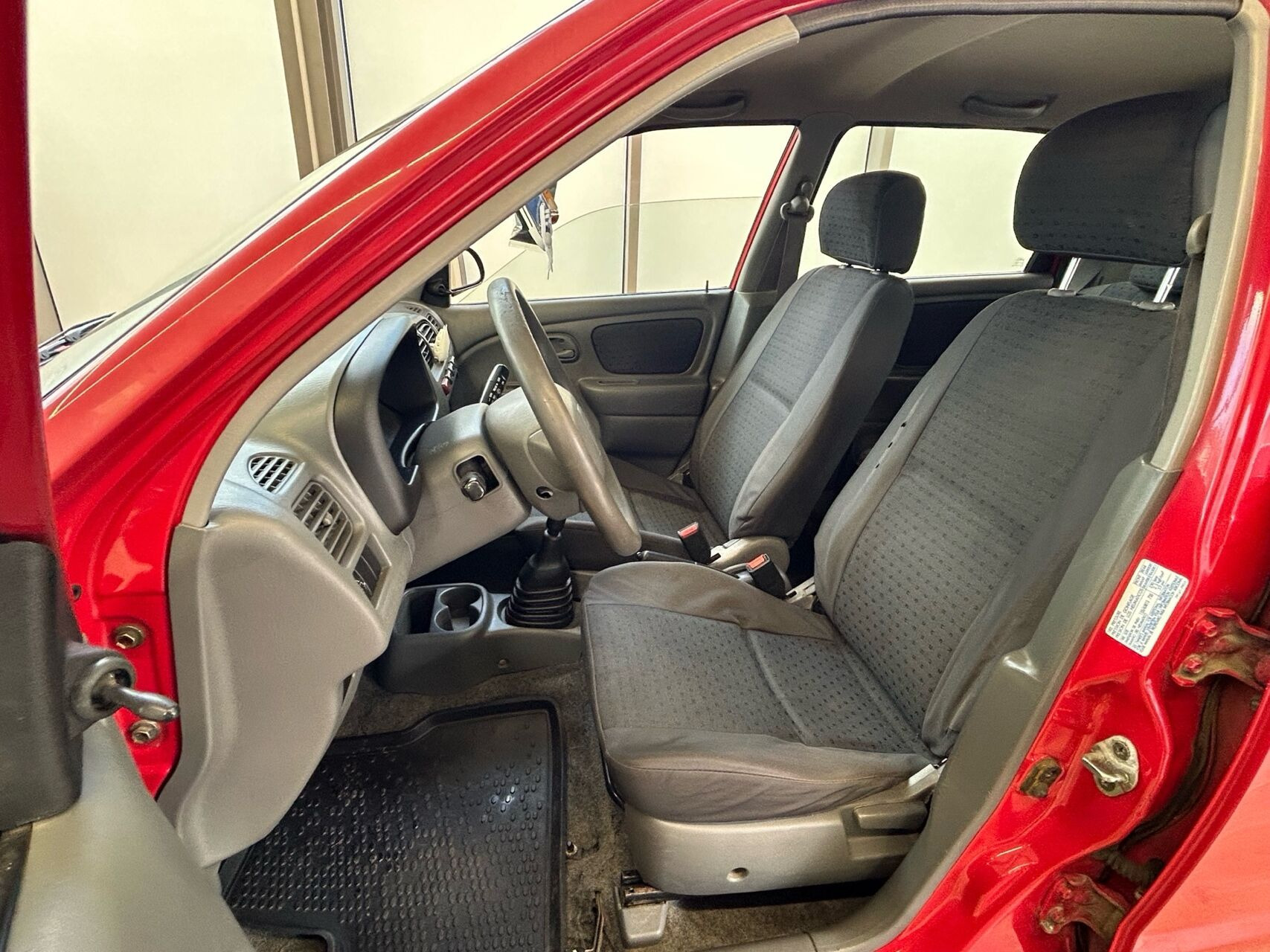 Rød Suzuki Alto fra 2004