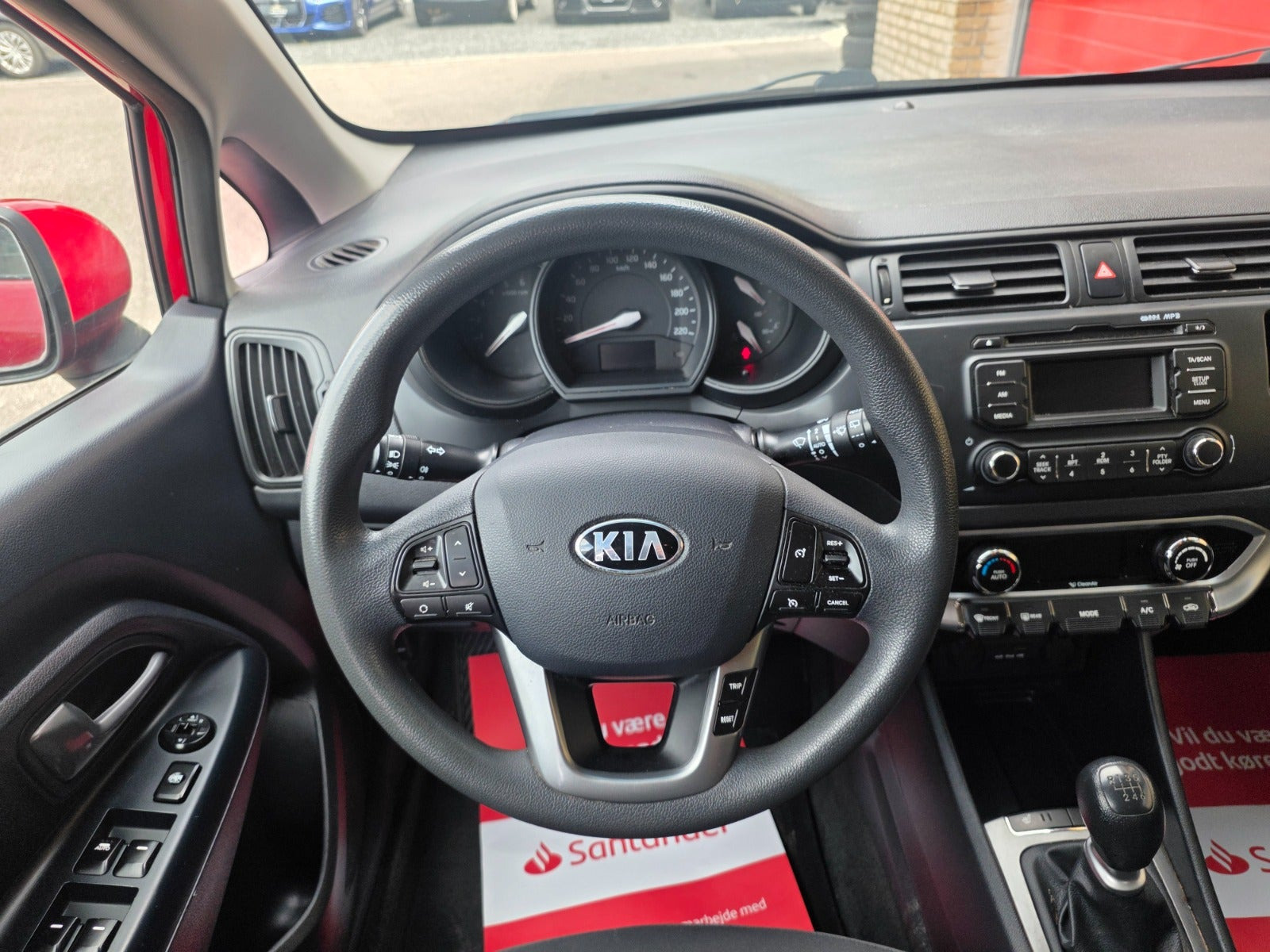 Rød Kia Rio fra 2014