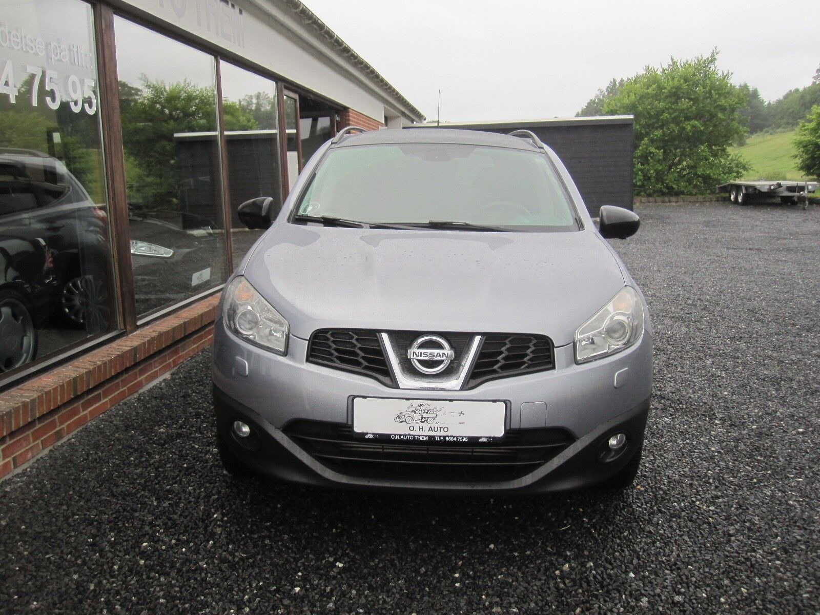 Blå Nissan Qashqai+2 fra 2013