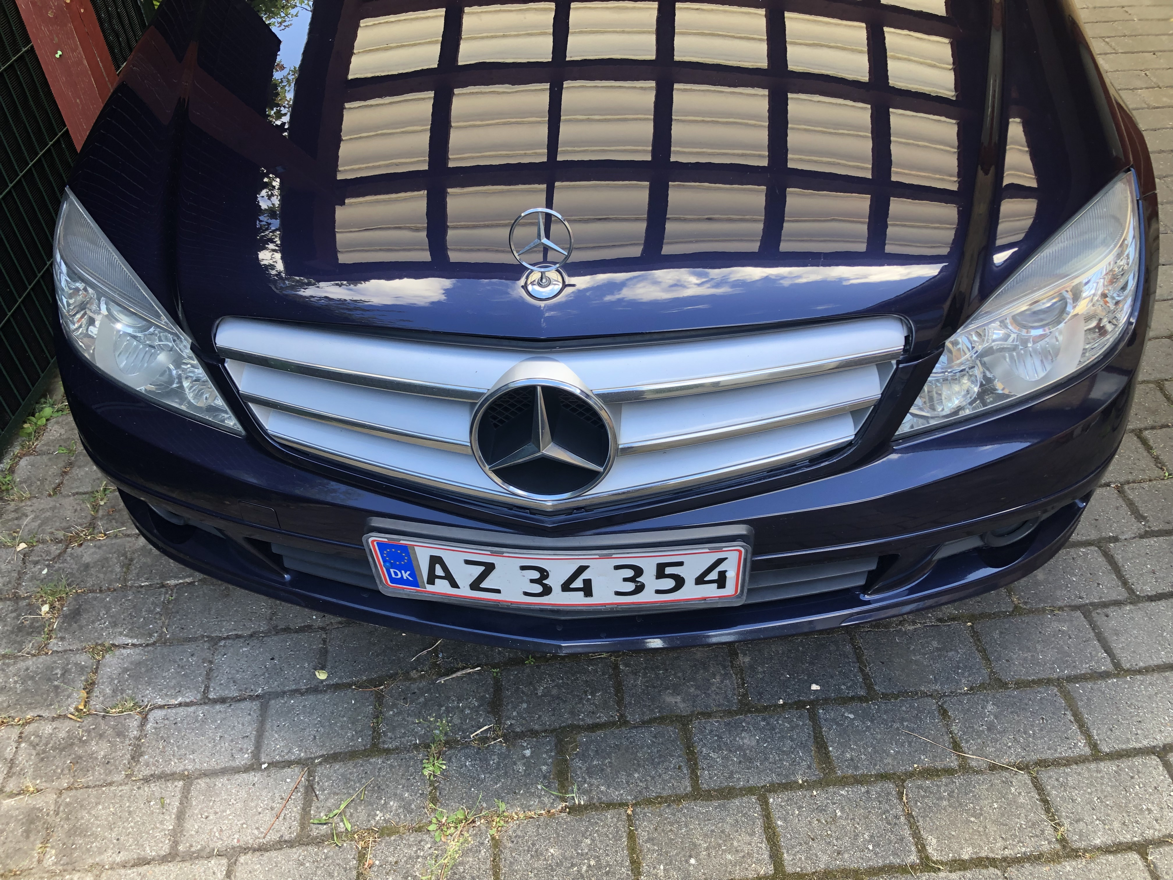 Blå Mercedes C180 fra 2010