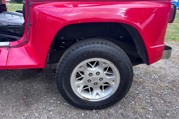 Gul Jeep Wrangler fra 1992