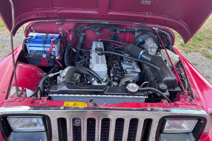 Gul Jeep Wrangler fra 1992