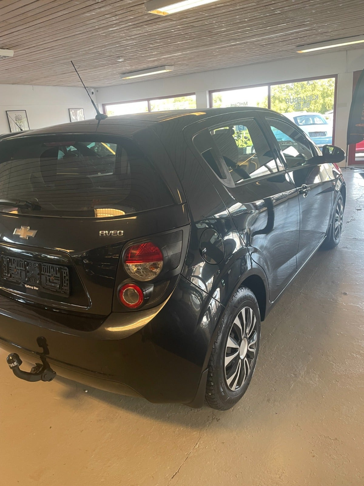 Gul Chevrolet Aveo fra 2013