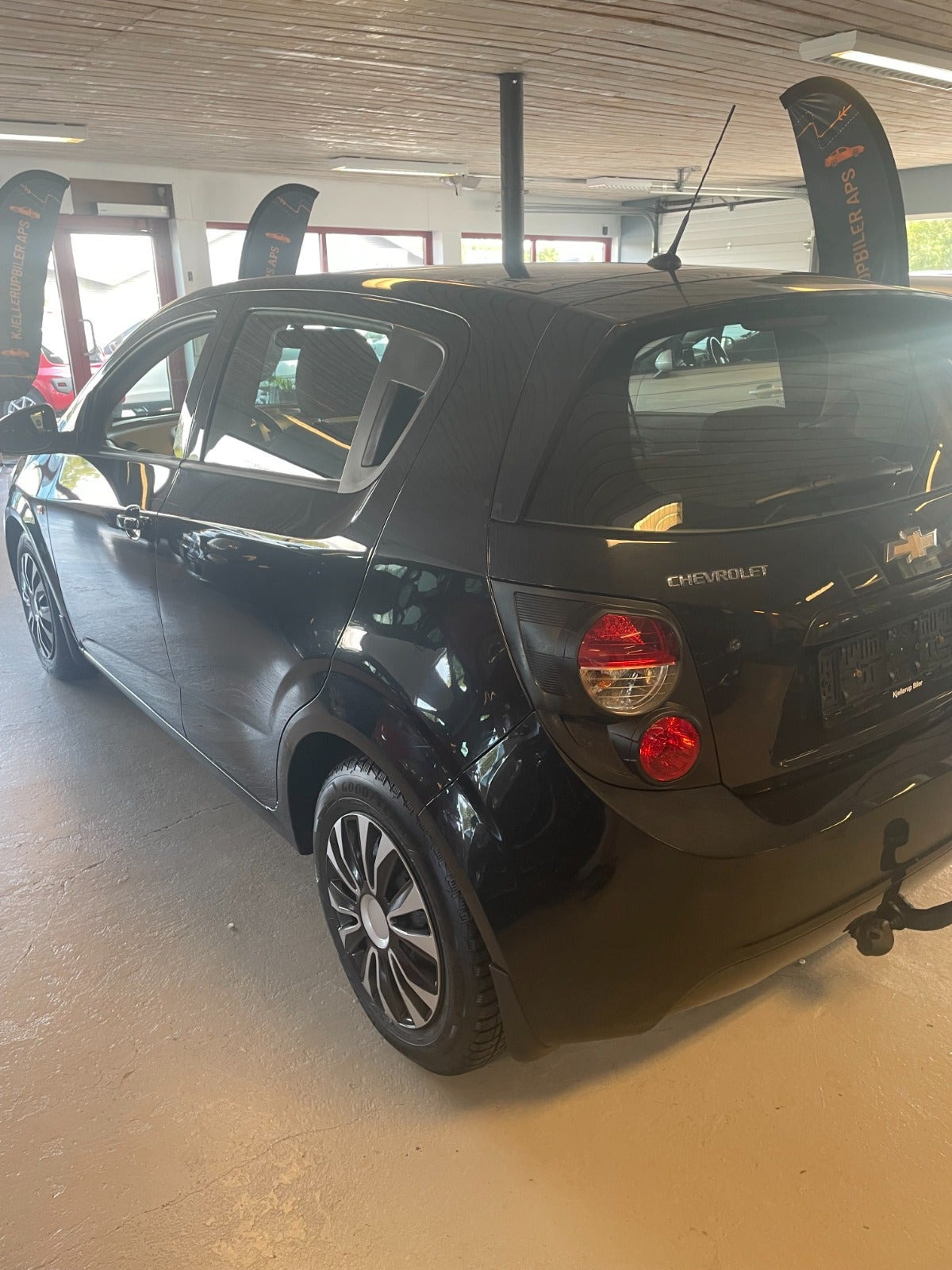 Gul Chevrolet Aveo fra 2013