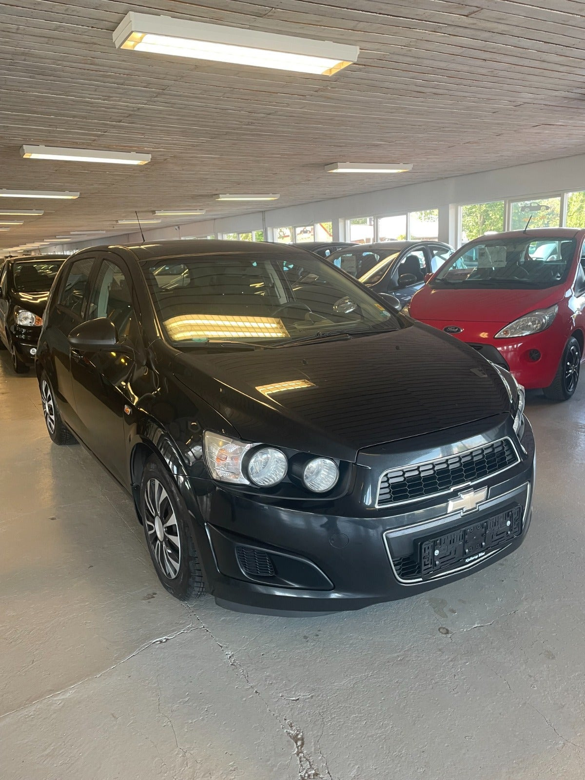 Gul Chevrolet Aveo fra 2013
