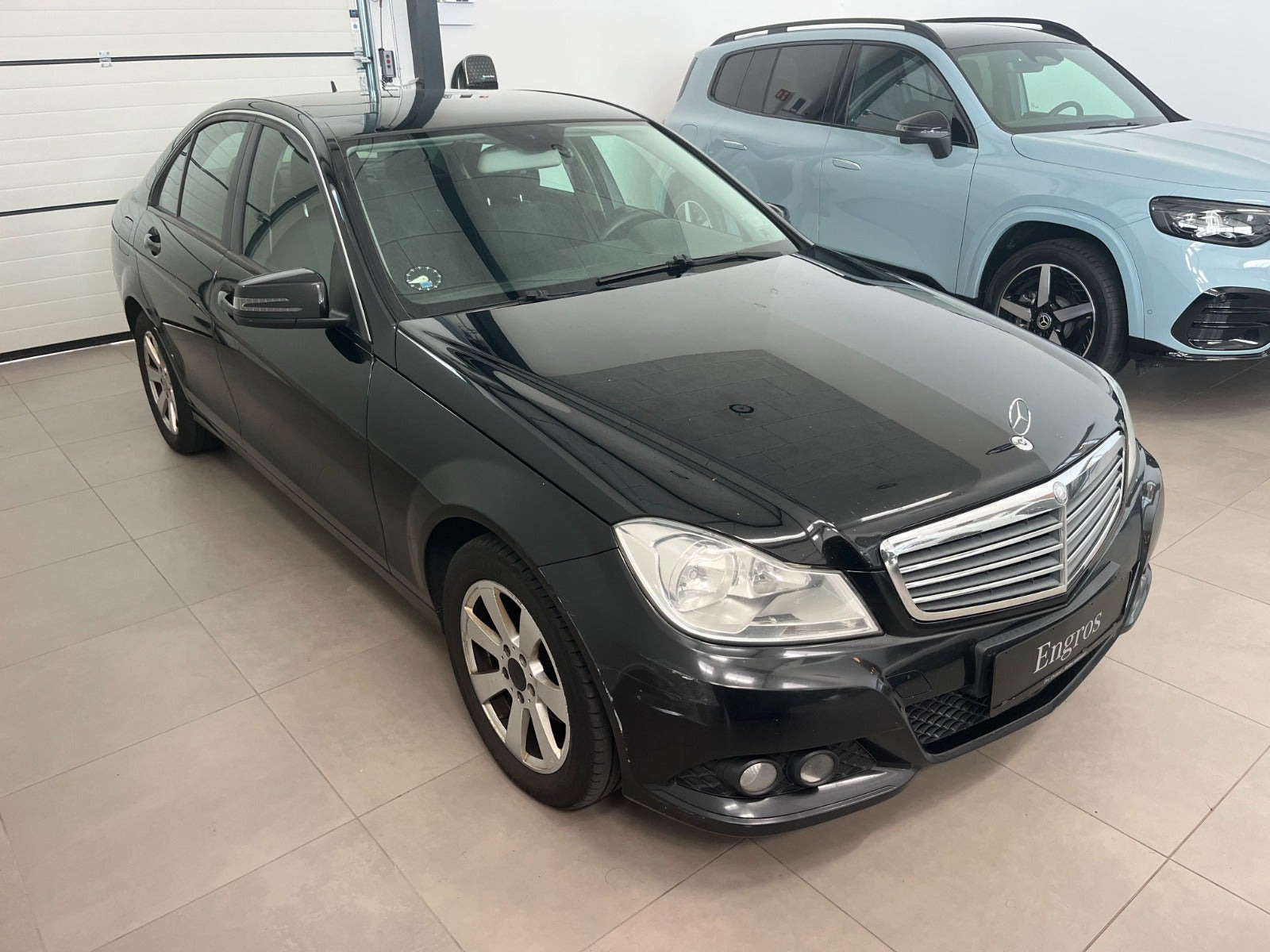 Grøn Mercedes C180 fra 2013