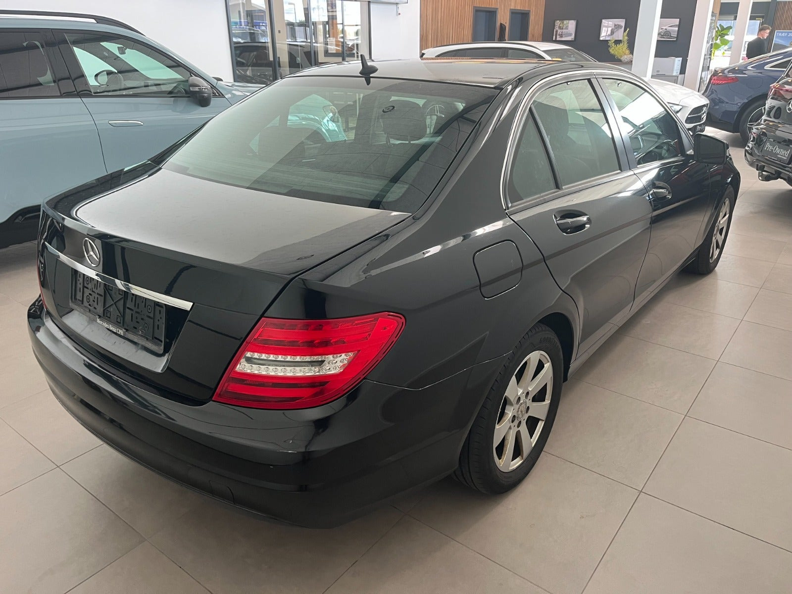 Grøn Mercedes C180 fra 2013