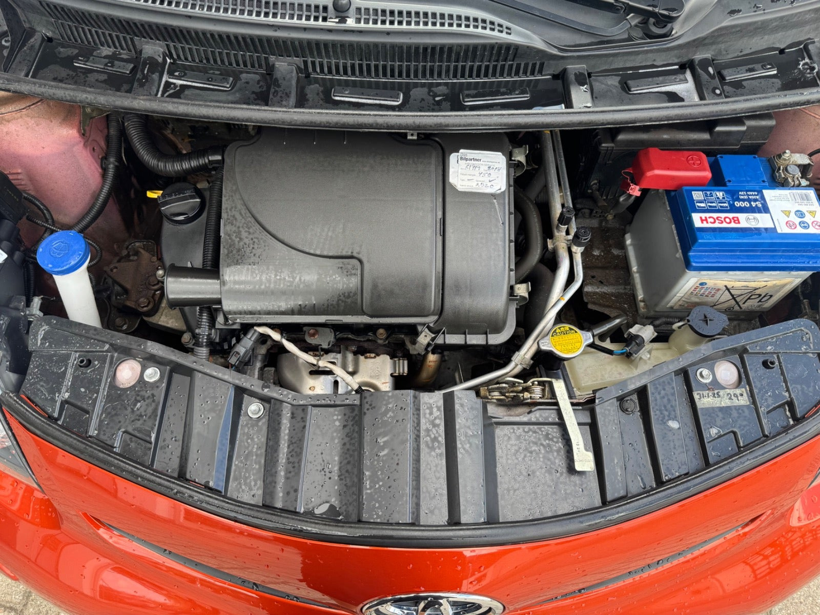 Orange Toyota Aygo fra 2012