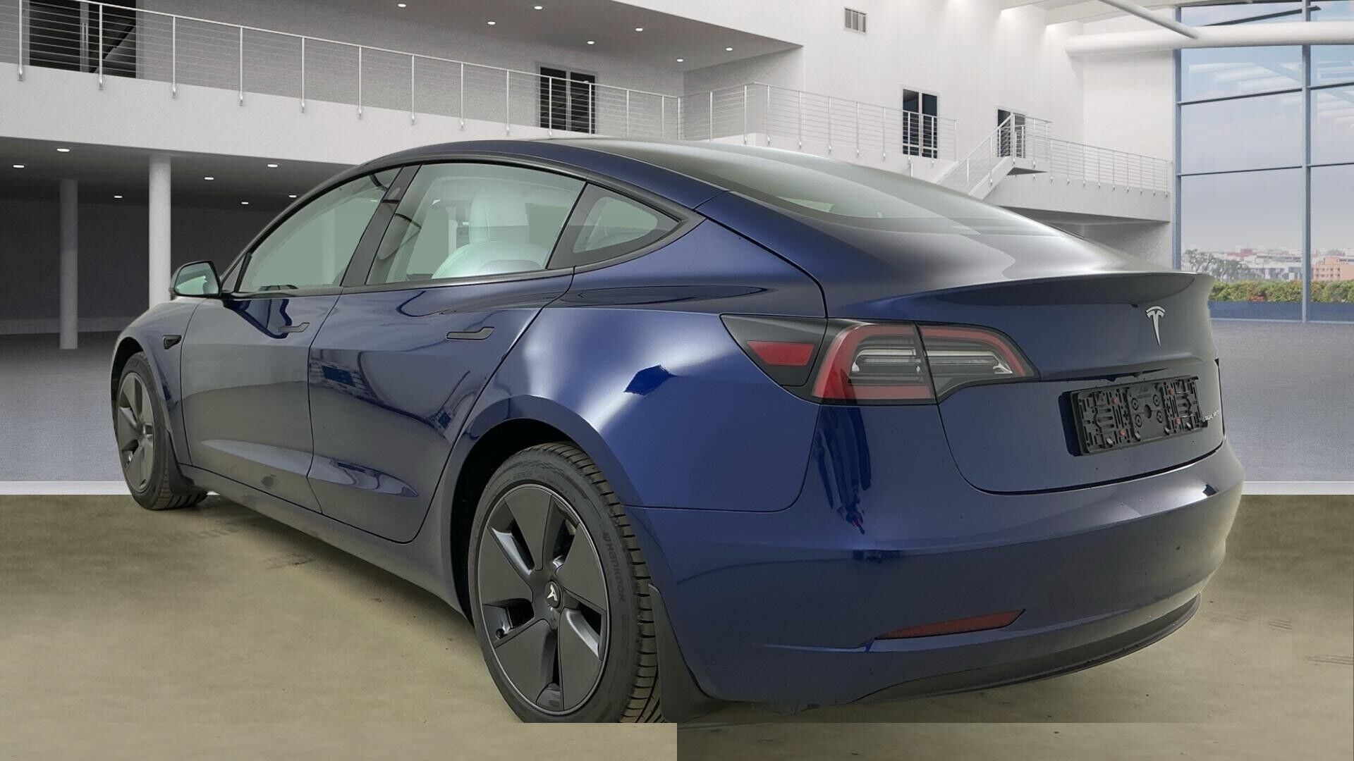 Blå Tesla Model 3 fra 2023