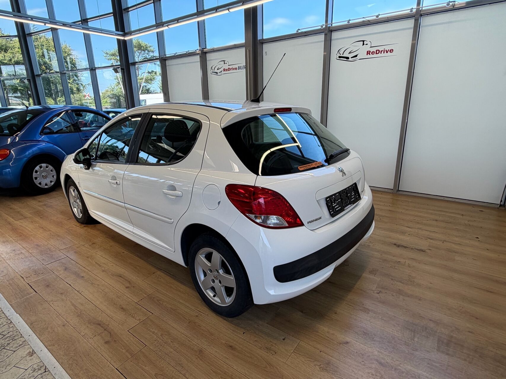 Sølv Peugeot 207 fra 2010