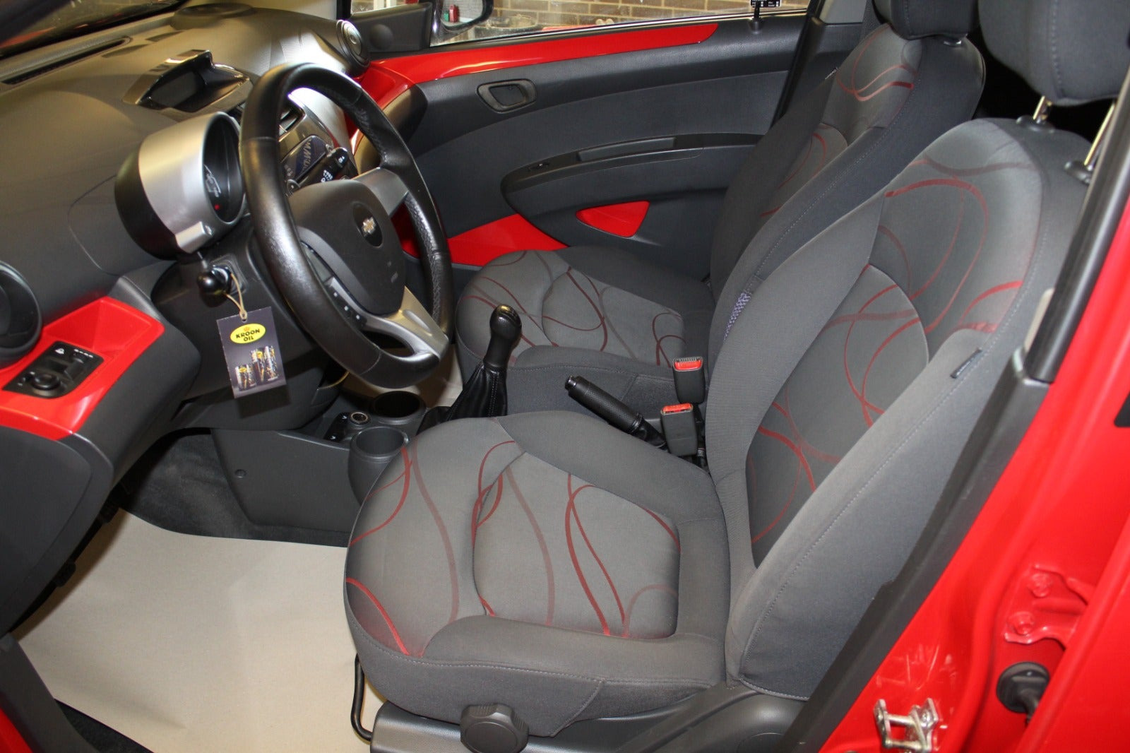 Rød Chevrolet Spark fra 2011