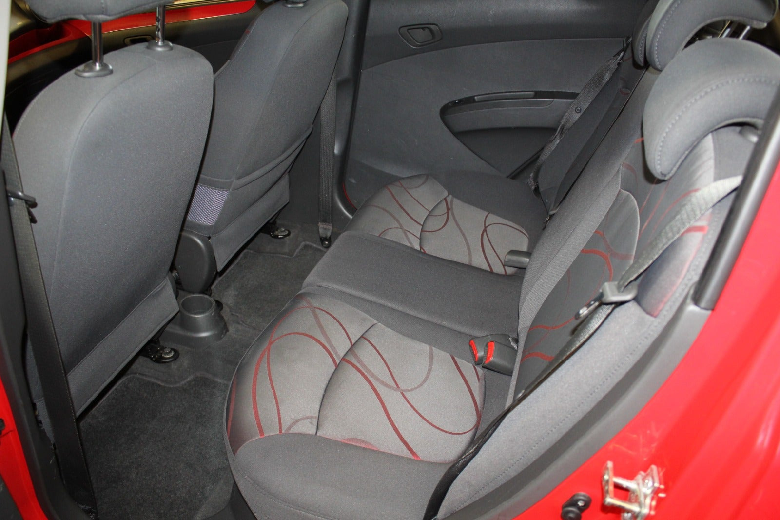 Rød Chevrolet Spark fra 2011