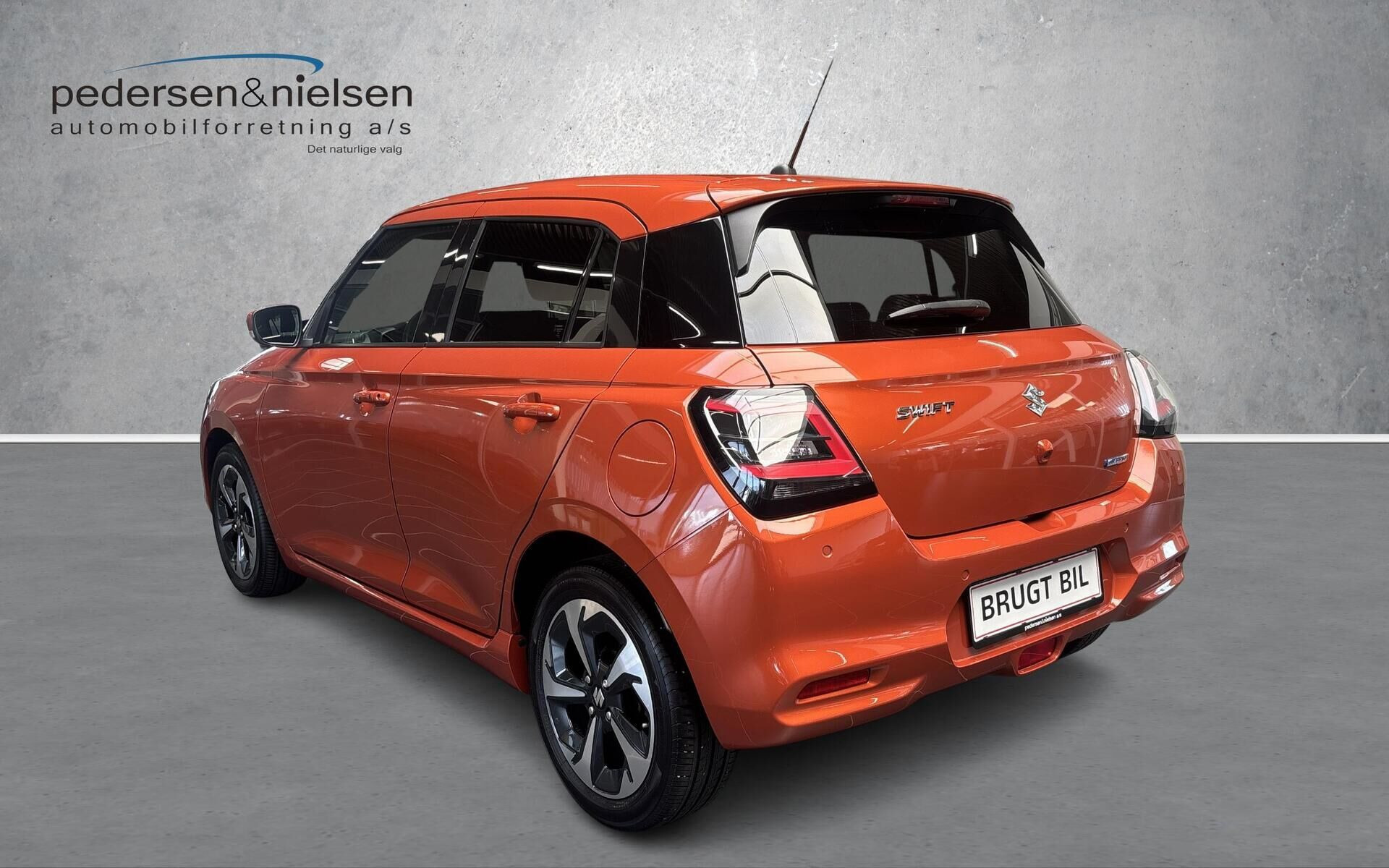 Orange Suzuki Swift fra 2024