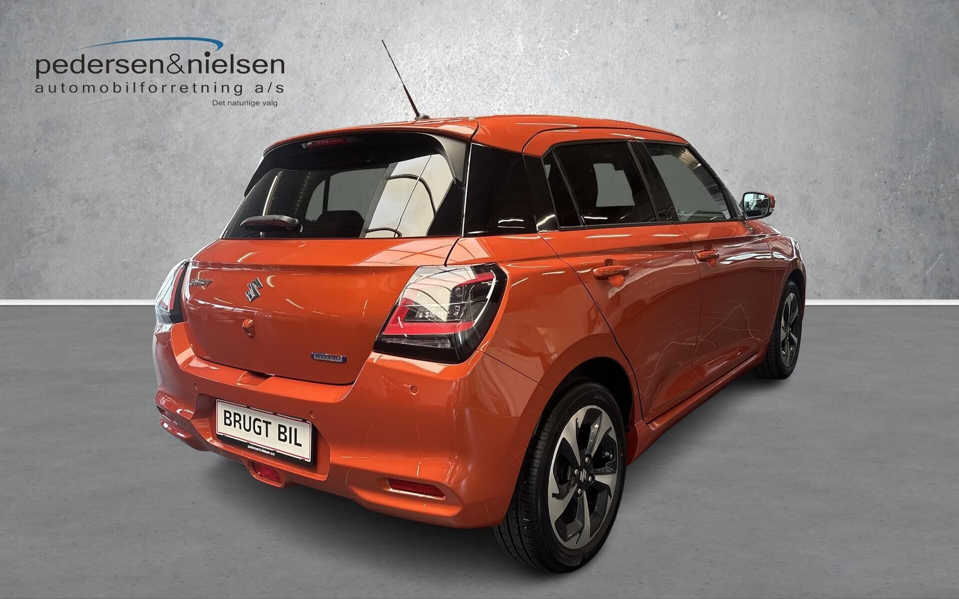 Orange Suzuki Swift fra 2024