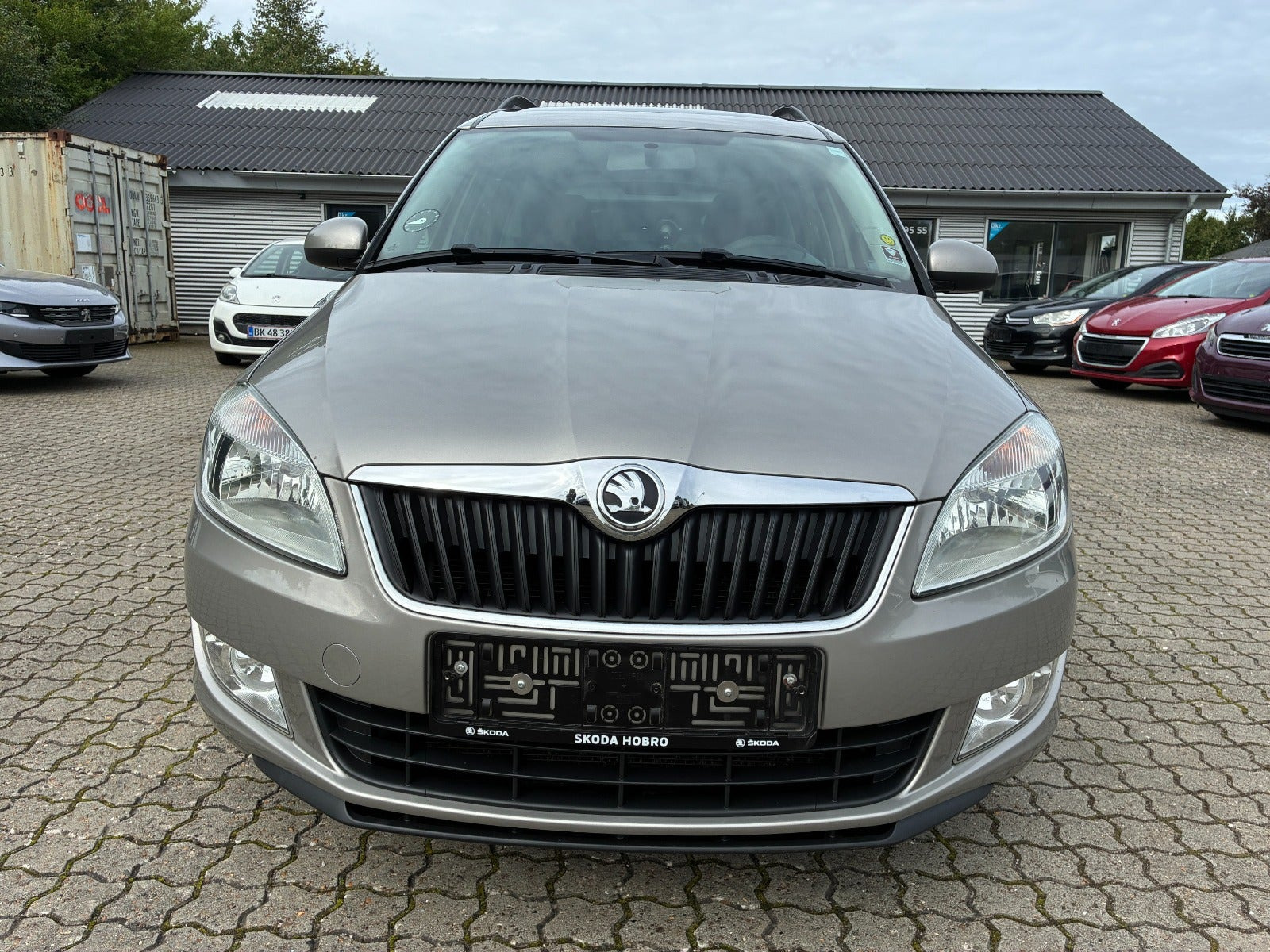 Orange Skoda Roomster fra 2014