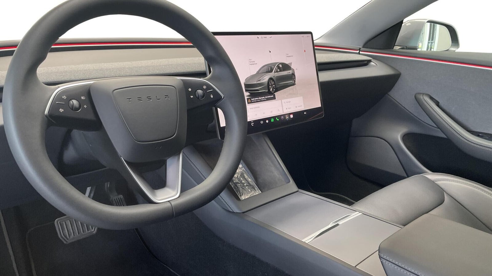 Grå Tesla Model 3 fra 2025