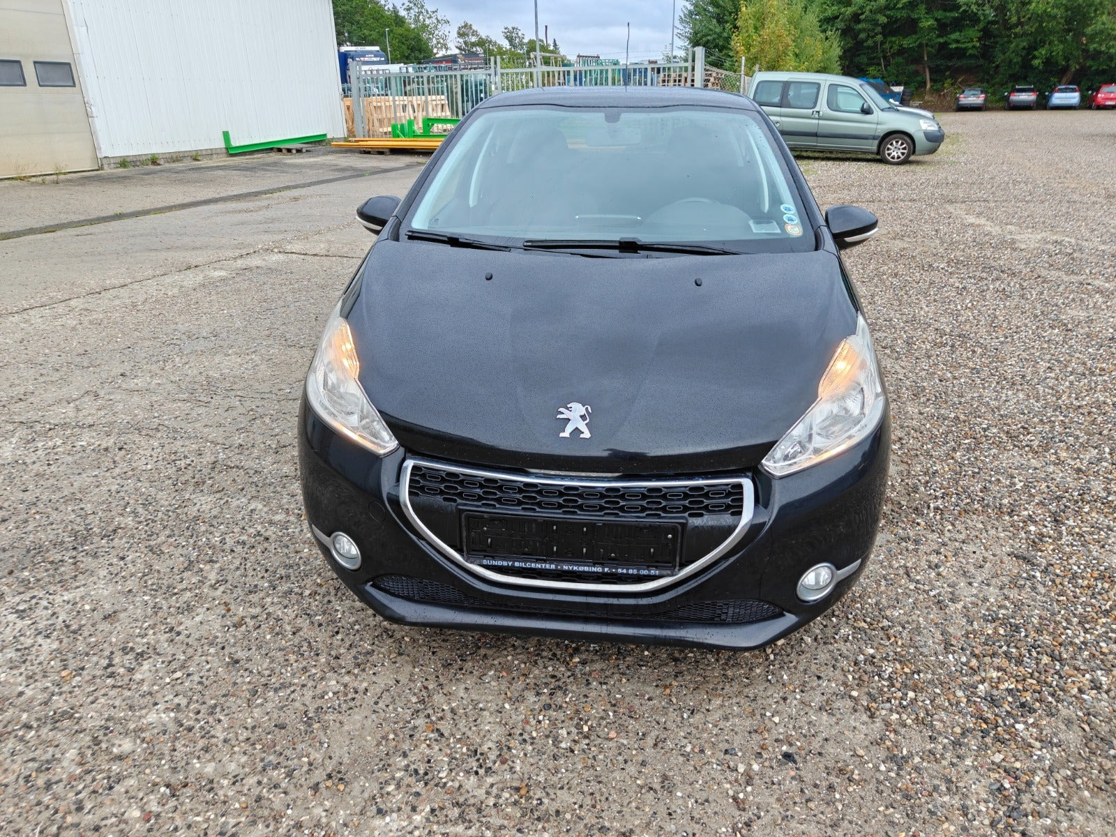 Gul Peugeot 208 fra 2014