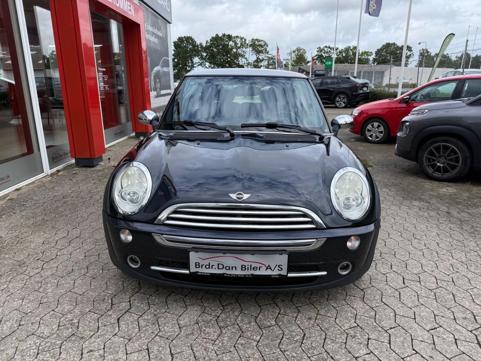 Blå Mini Cooper fra 2006