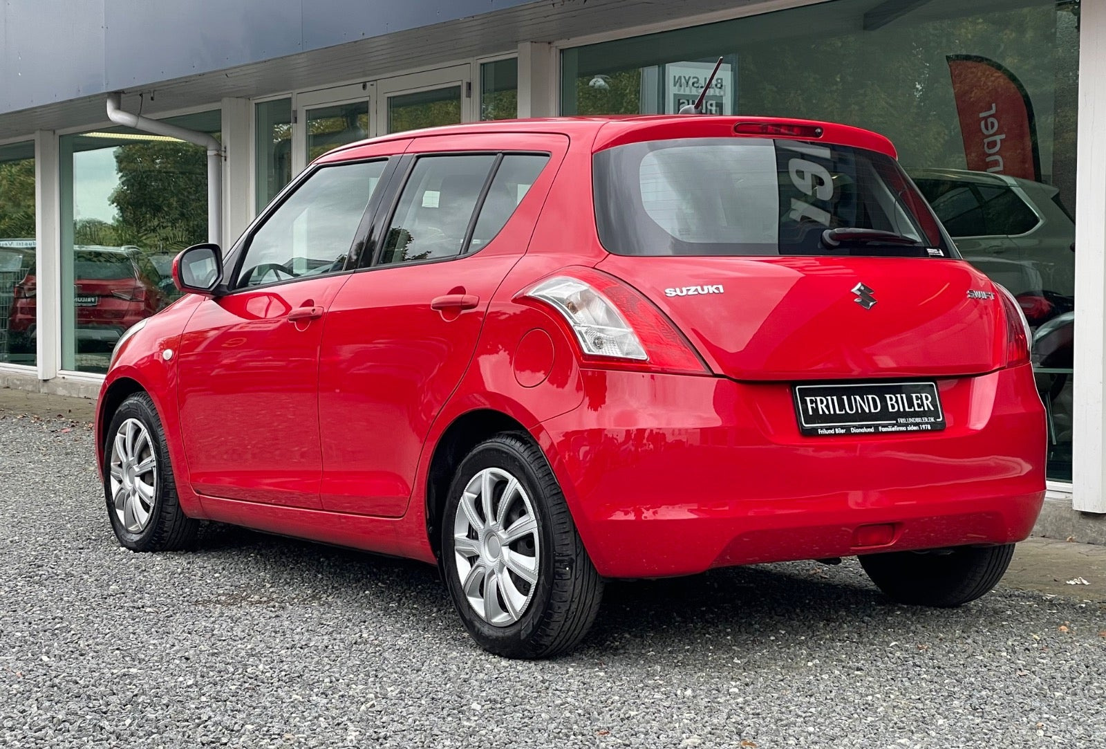 Rød Suzuki Swift fra 2014