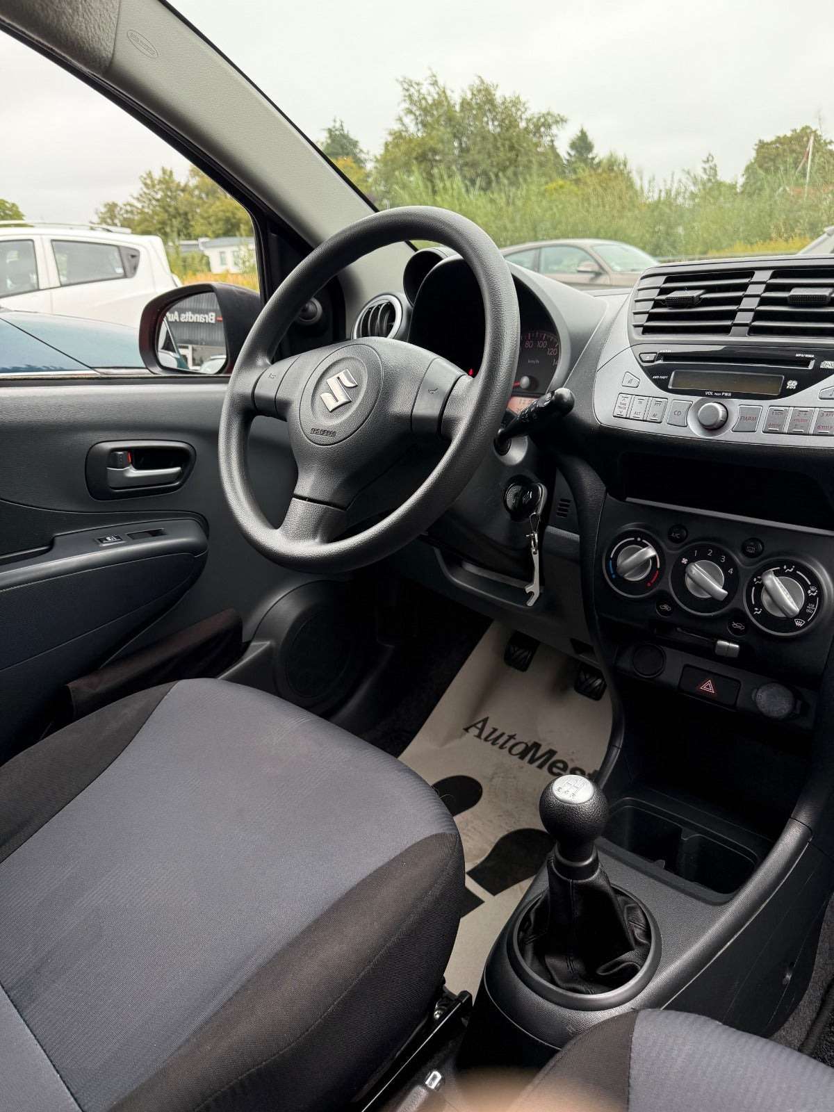 Rød Suzuki Alto fra 2013