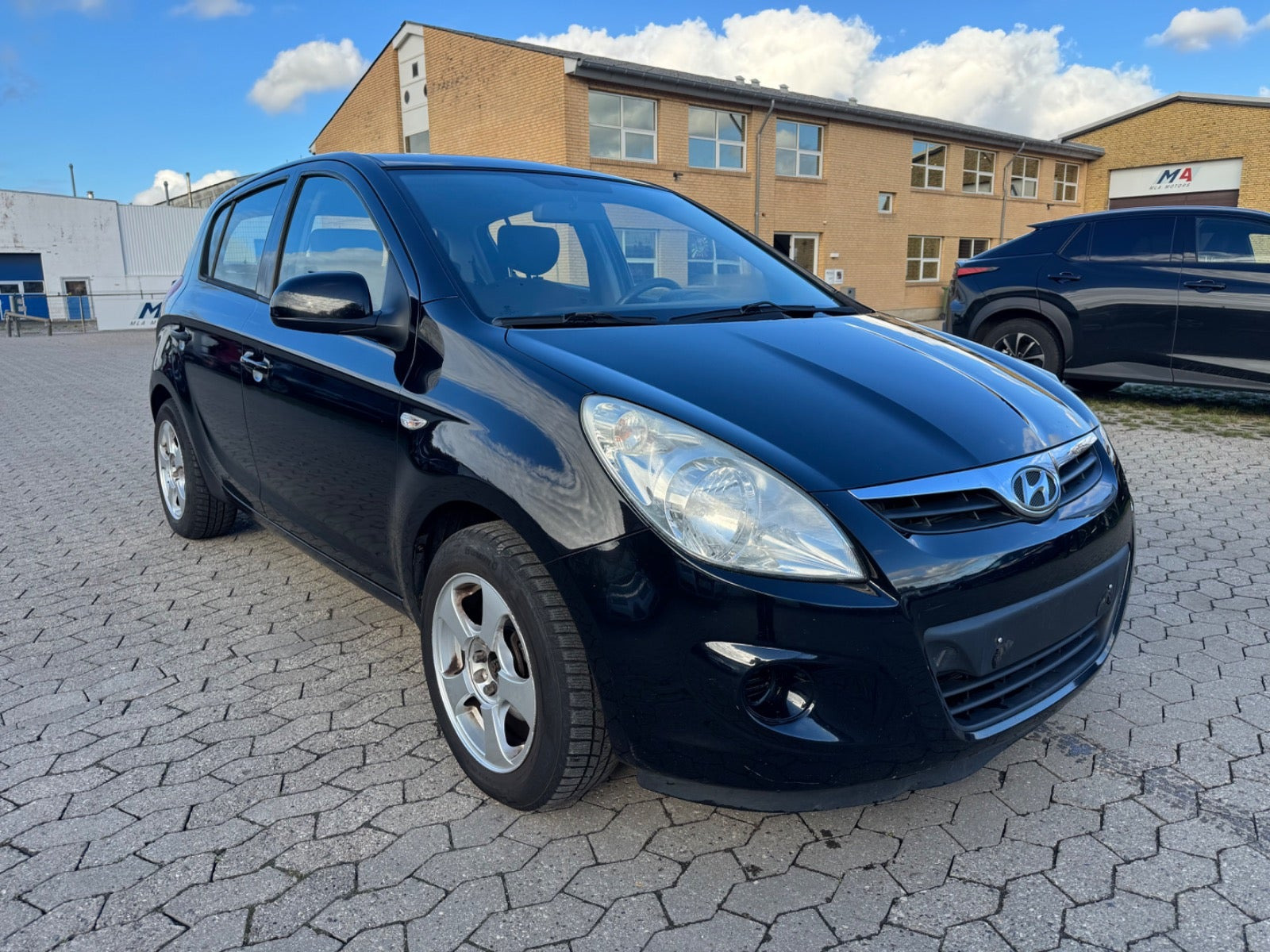 Rød Hyundai i20 fra 2009