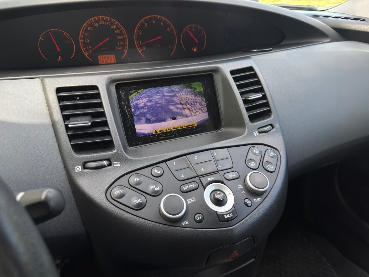 Beige Nissan Primera fra 2006