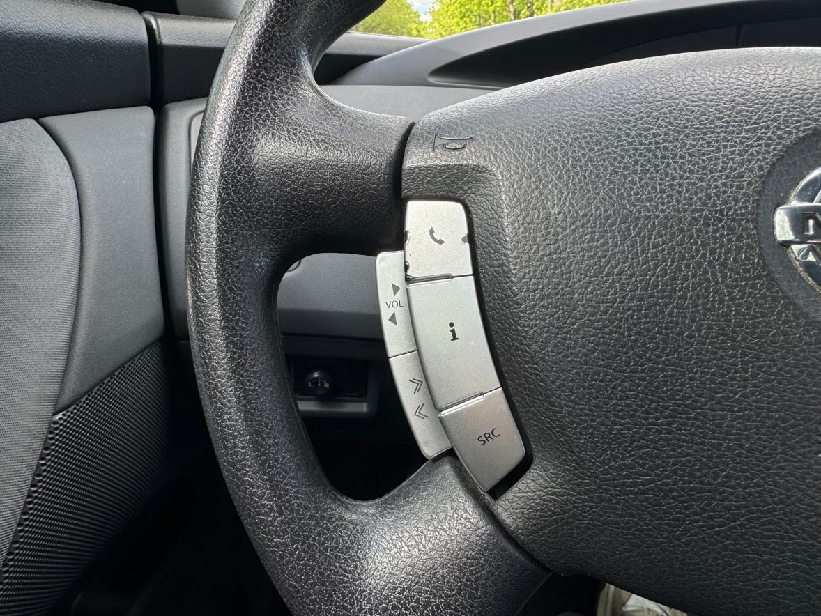 Beige Nissan Primera fra 2006