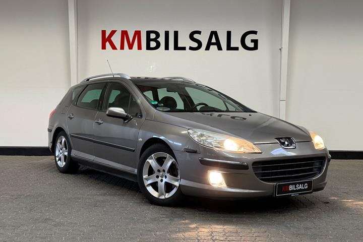 Orange Peugeot 407 fra 2005