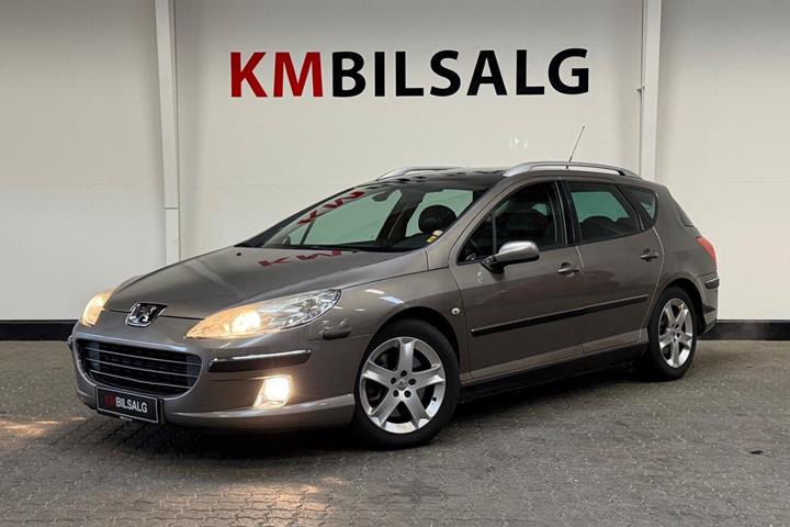 Orange Peugeot 407 fra 2005