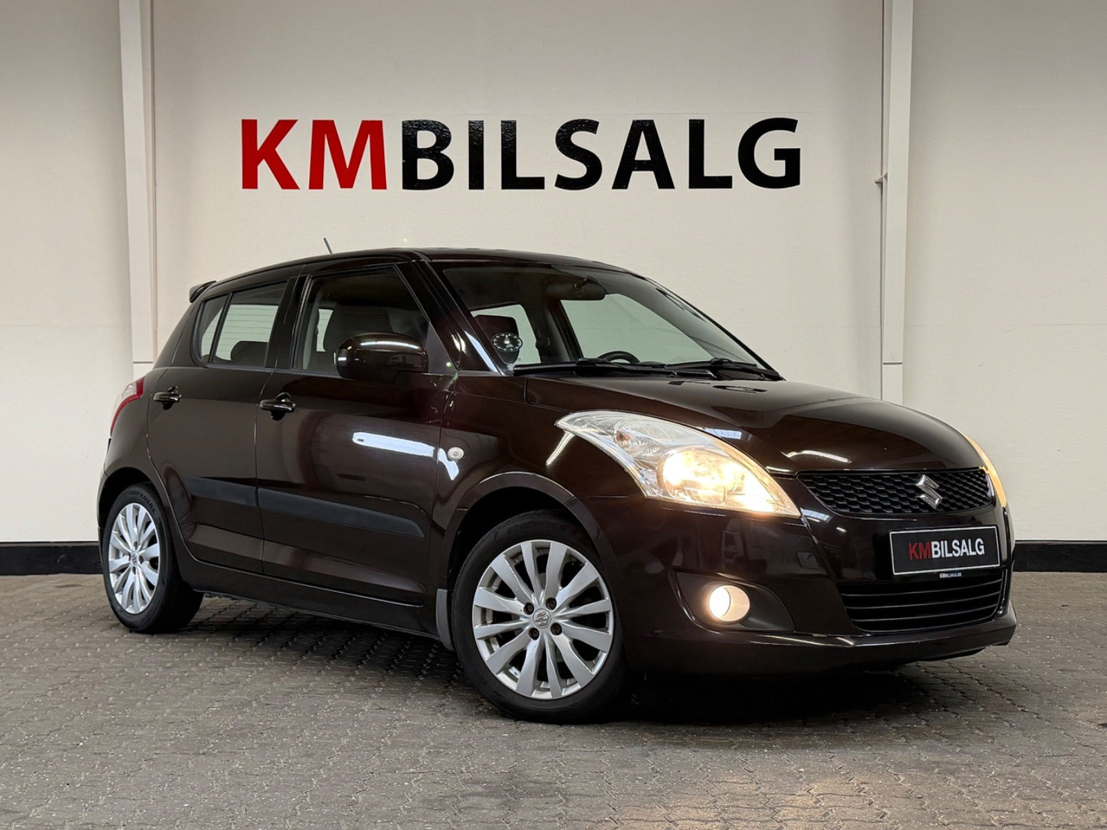 Brun Suzuki Swift fra 2012