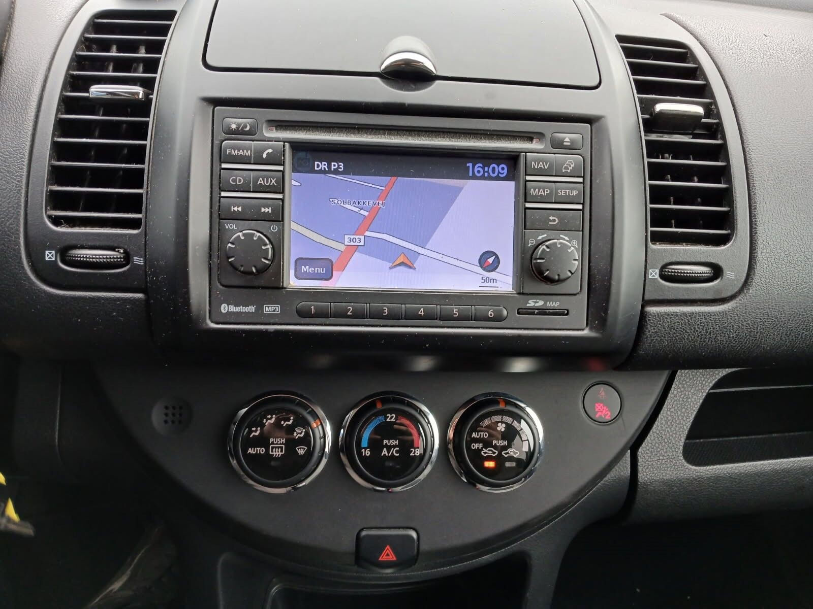 Rød Nissan Note fra 2011