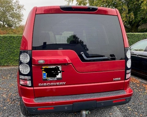 Rød Land Rover Discovery 4 fra 2014