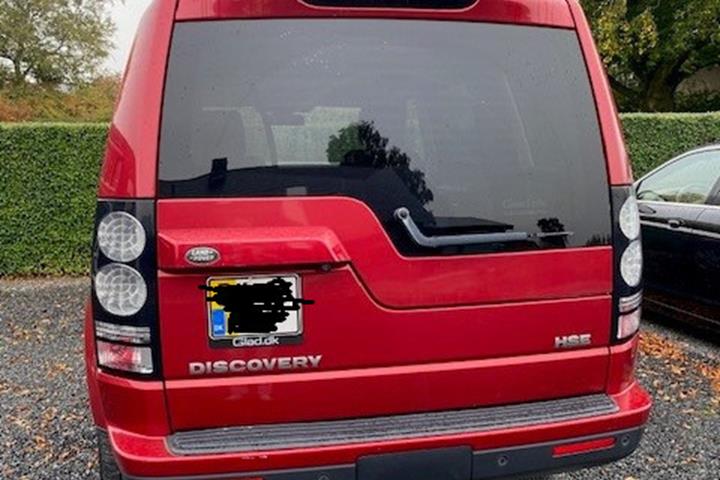 Rød Land Rover Discovery 4 fra 2014