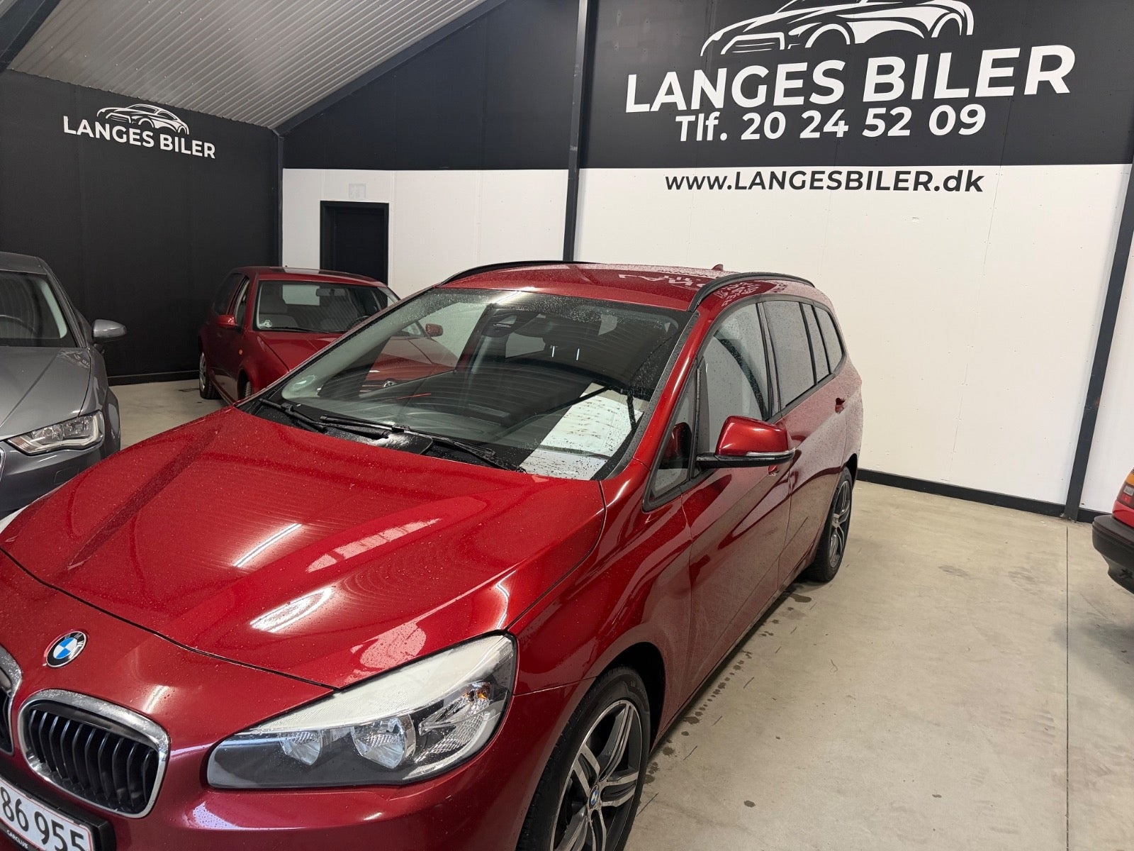 Rød BMW 216d fra 2015