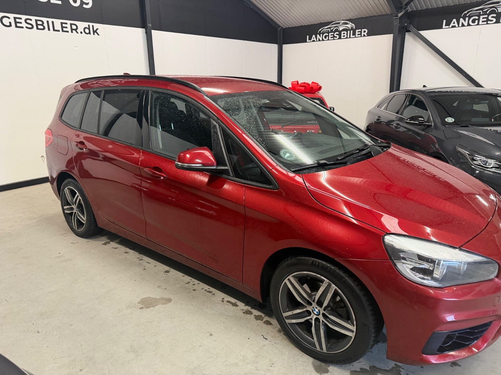 Rød BMW 216d fra 2015