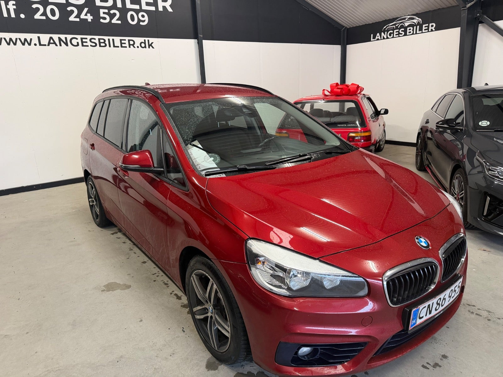 Rød BMW 216d fra 2015