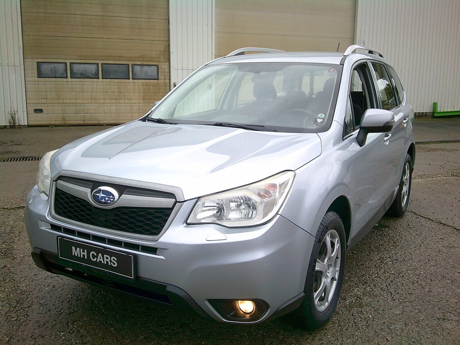 Gul Subaru Forester fra 2013
