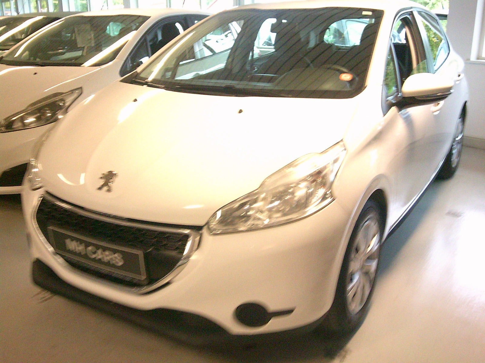Gul Peugeot 208 fra 2014