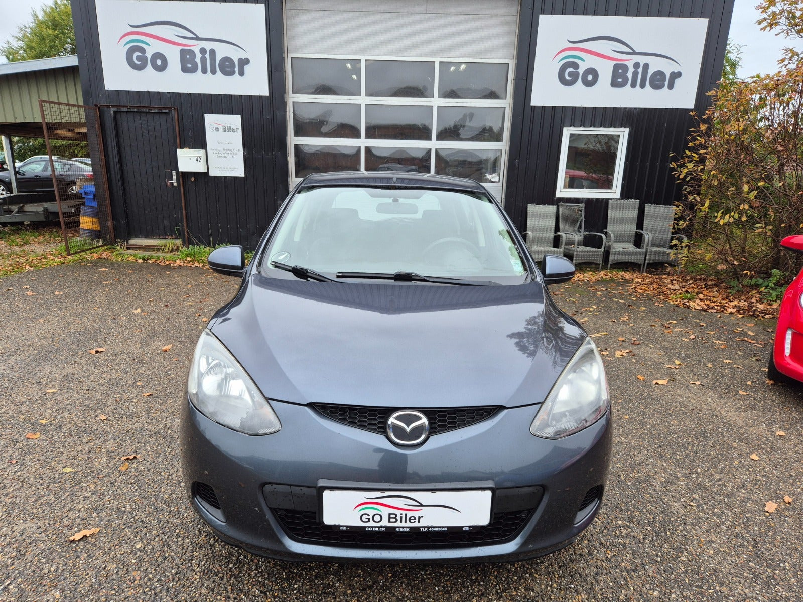 Grøn Mazda 2 fra 2009