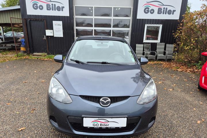 Grøn Mazda 2 fra 2009