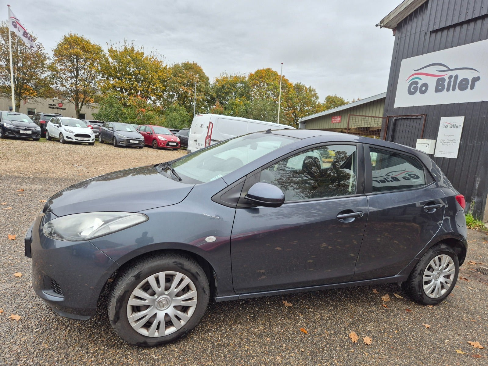 Grøn Mazda 2 fra 2009