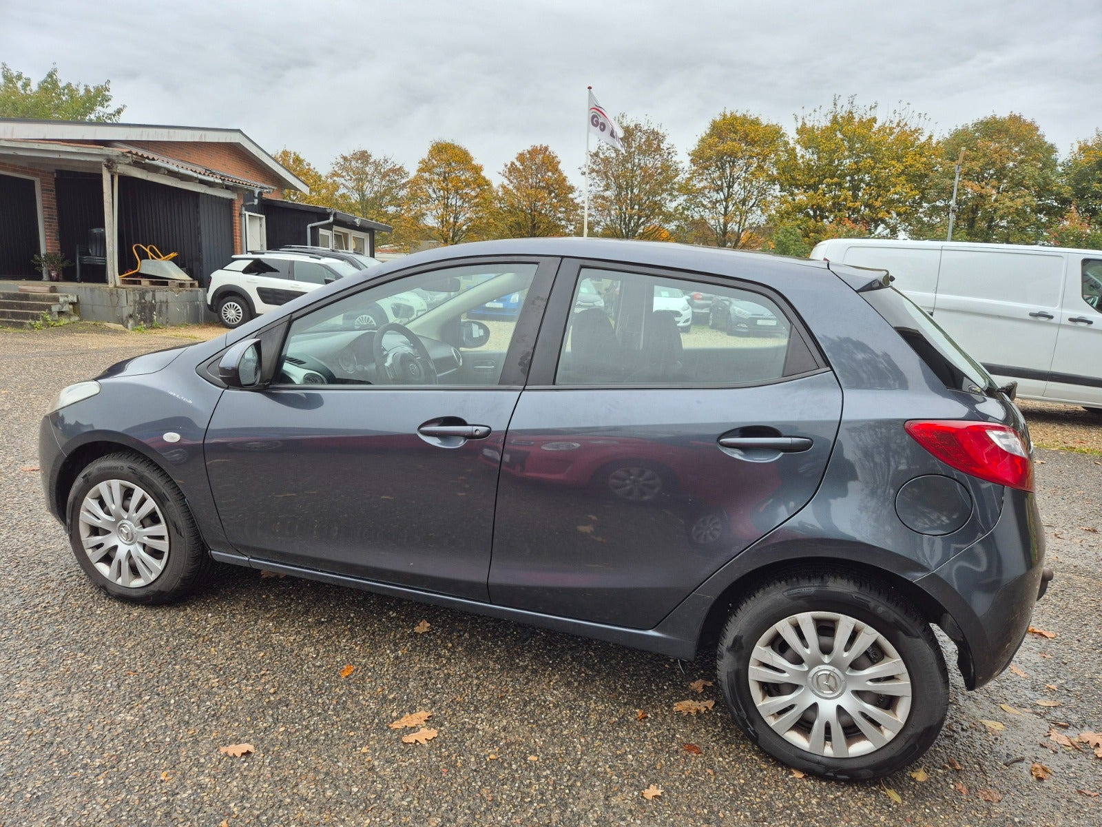 Grøn Mazda 2 fra 2009