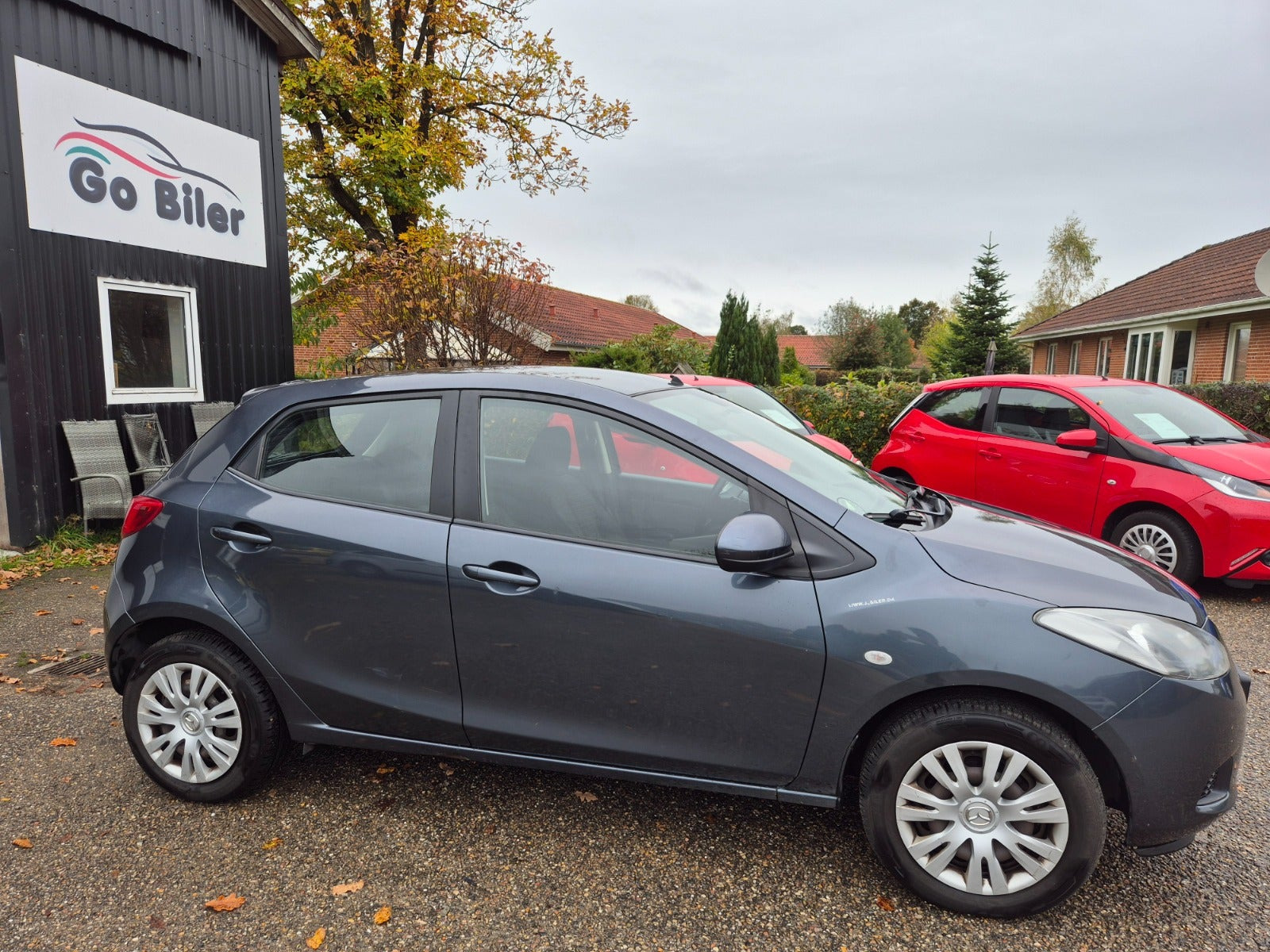 Grøn Mazda 2 fra 2009