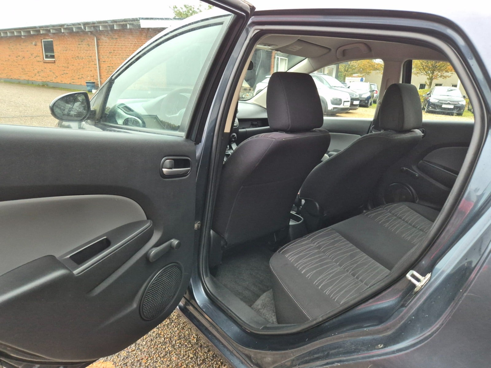 Grøn Mazda 2 fra 2009