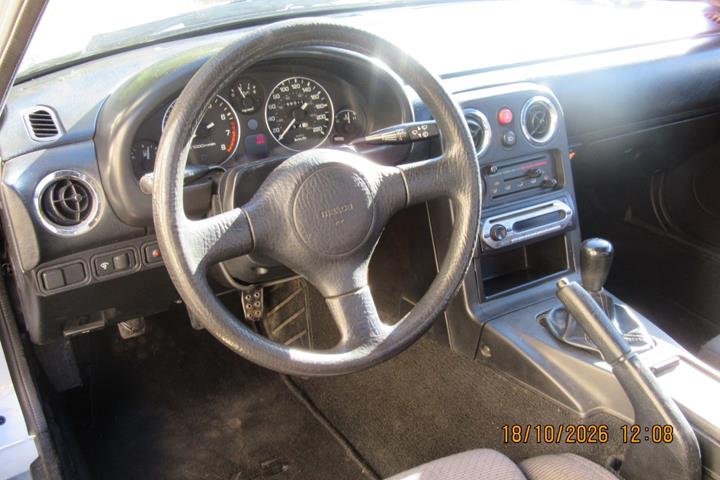 Sølv Mazda MX-5 fra 1990