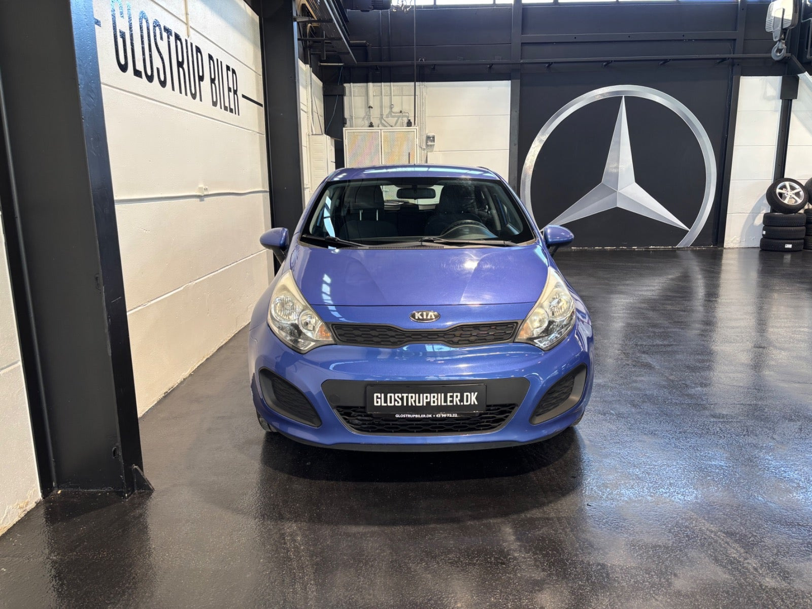 Blå Kia Rio fra 2013