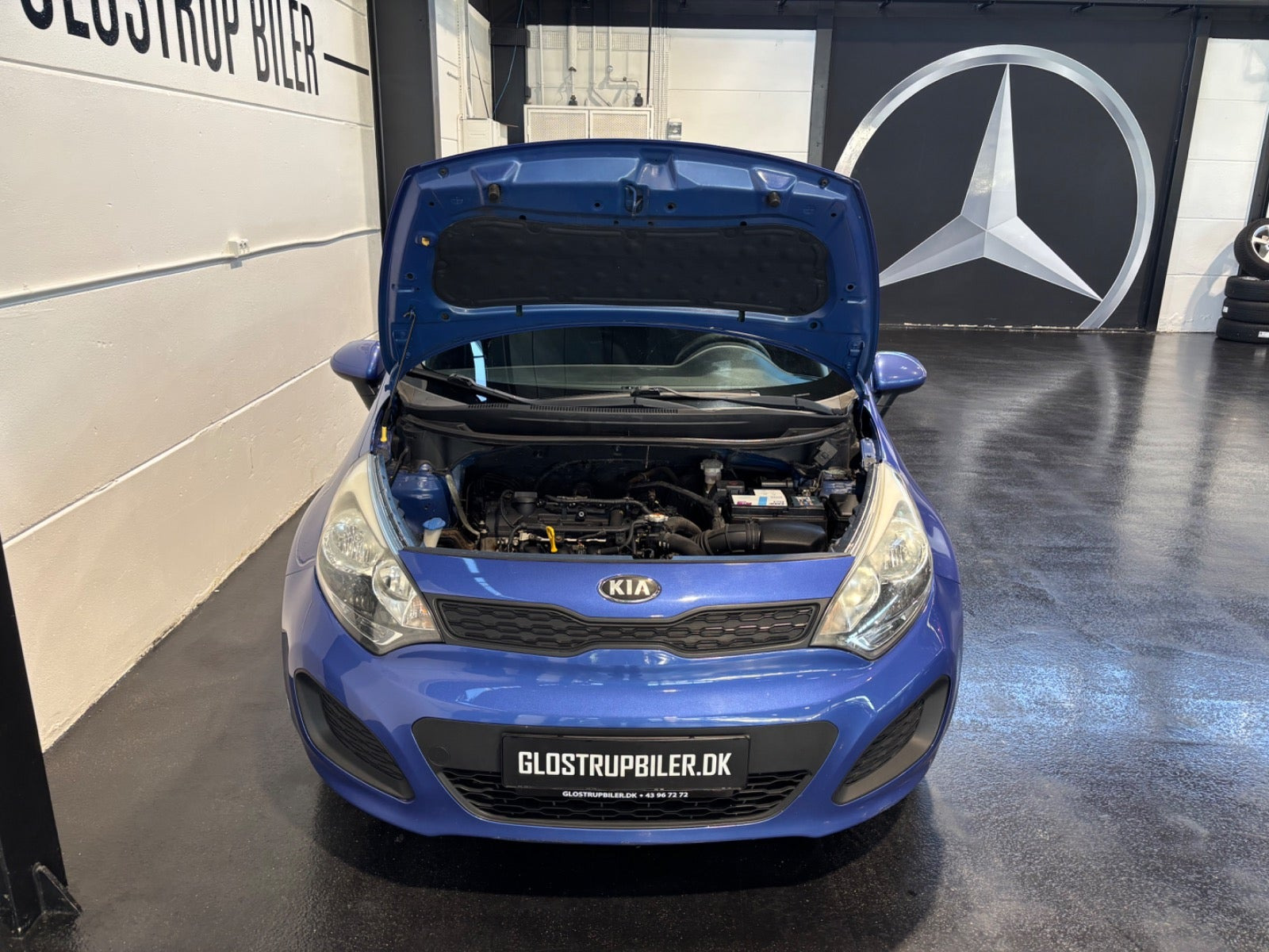 Blå Kia Rio fra 2013